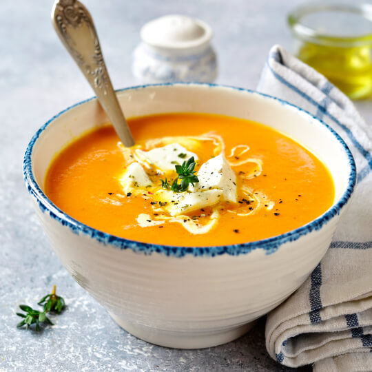 Butternut squash soup with cheese and pesto